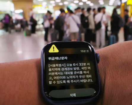 Sirens, alerts unsettle foreign residents in chaotic Seoul morning