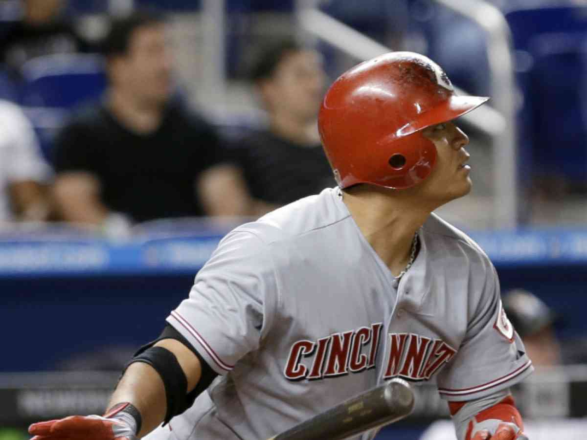 Cincinnati Reds' Derek Dietrich watches his solo home run during