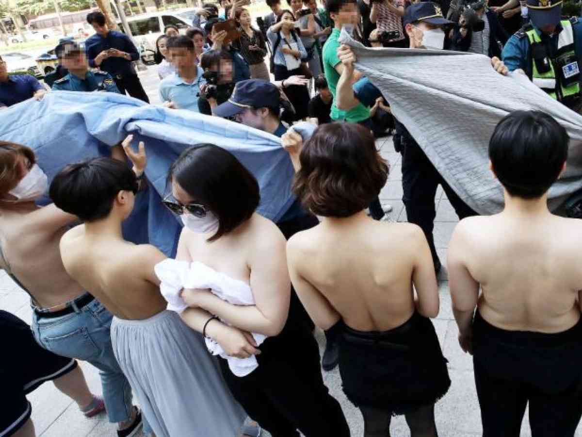 Feminist activists protest topless, Facebook Korea apologizes