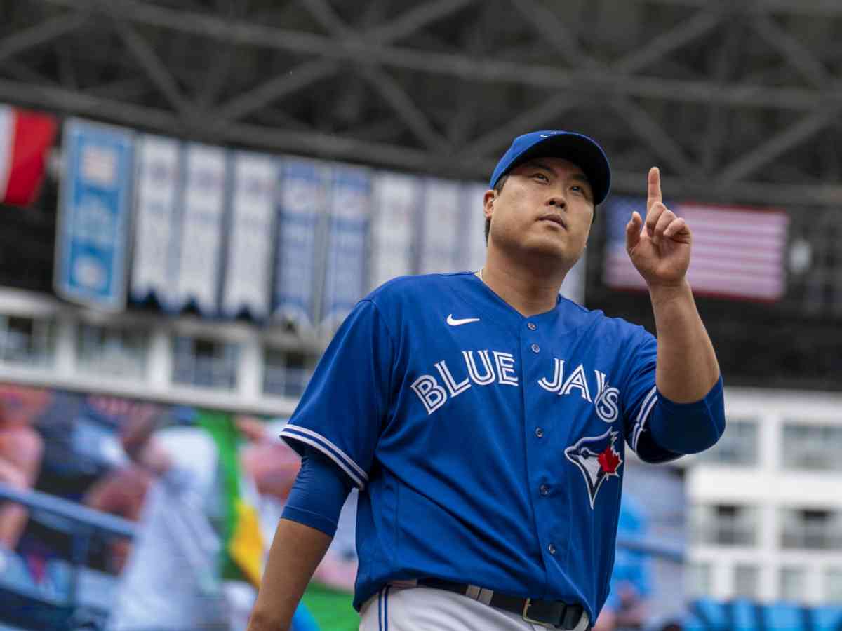 Toronto Blue Jays' Daulton Varsho walks in the dugout before a