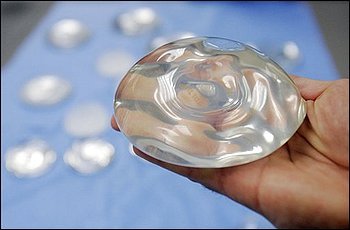 Federal health officials said Wednesday, Jan. 26, 2011, they are investigating a possible link between breast implants and a very rare form of cancer after reviewing a handful of cases reported over the last 13 years. (Donna McWilliam/AP)