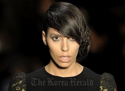 Brazilian transsexual model Lea T. presents a creation by designer Alexandre Herchcovitch during the 2011-2012 Fall-Winter collections of the Sao Paulo Fashion Week in Sao Paulo, Brazil. (AFP-Yonhap News.)