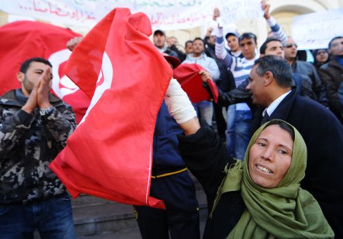 Tunisians celebrate the anniversary of the first month of the Tunisian revolution Monday. (AFP-Yonhap News)