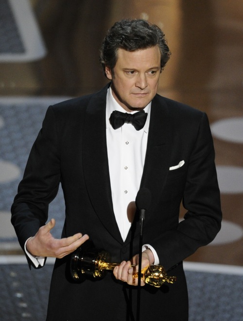 Colin Firth accepts the Oscar for best performance by an actor in a leading role for 