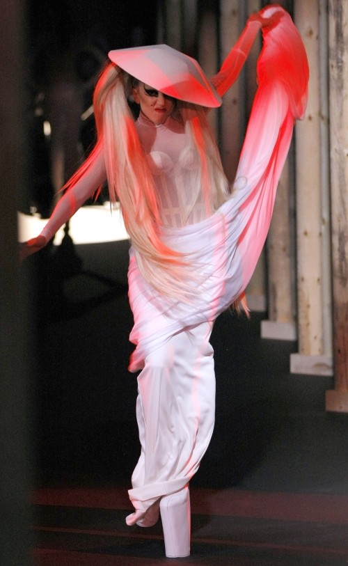 Lady Gaga shows a creation, part of French designer Thierry Mugler Fall-Winter ready-to-wear 2012, fashion collection, presented in Paris, Wednesday, March. 2, 2011. (AP-Yonhap)