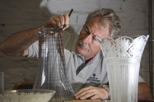 A man works at the the House of Waterford Crystal on the Mall in Waterford in Ireland in June 2010. (AP-Yonhap News)