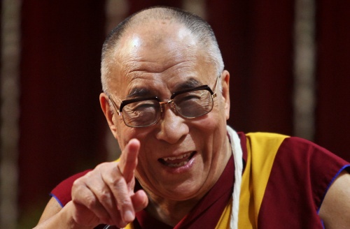 Tibetan spiritual leader the Dalai Lama gestures as he addresses the Mumbai University students in Mumbai, India, Friday, Feb. 18, 2011. (AP-Yonhap News)