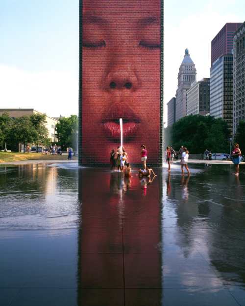 Children play in front of the “Crown Fountain” in Chicago, Illinois. (The Spring)