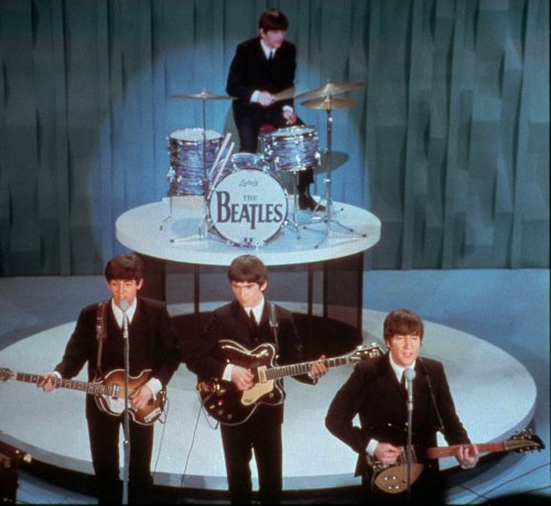 The Beatles (front row from left) Paul McCartney, George Harrison, John Lennon and Ringo Starr on drums, perform at the “Ed Sullivan Show,” in New York. (AP-Yonhap News)