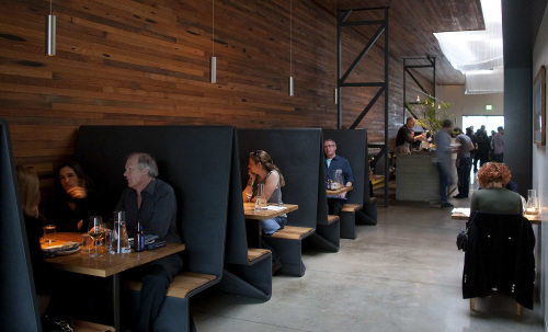 Bar Agricole in San Francisco is bright and spacious, but the tall booths provide intimacy for diners. (Los Angeles Times/MCT)