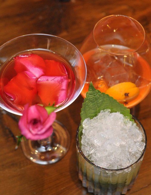 Bartender Park’s Rose Martini (left) and Single Pleasure (center), along with the Timber House’s popular A.K Mojito. (Lee Sang-sub/The Korea Herald)