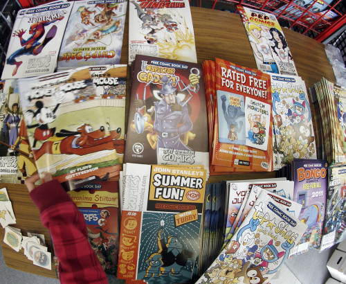 Some of the the free comic books available at the New Dimensions Comics store on Free Comic Book Day, May 7 in Cranberry, Pennsylvania. (AP-Yonhap News)