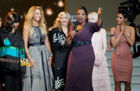 Oprah Winfrey speaks as she is surrounded by, from left, Patti LaBelle, Beyonce, Madonna, Dakota Fanning and Halle Berry. (AP)