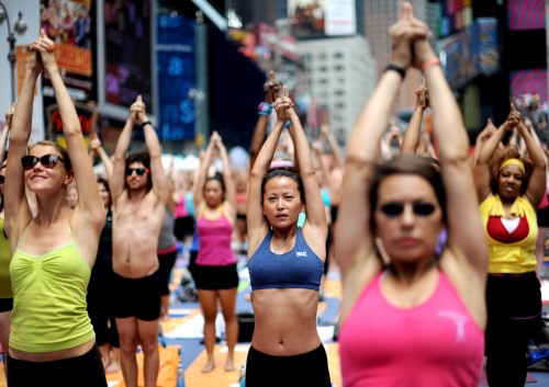 Yoga enthusiasts practice yoga during the 