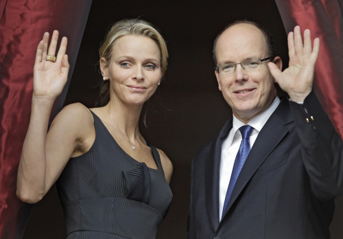 Prince Albert II of Monaco and his fiancee Charlene Wittstock attend to the St Jean Religious Parade , Thursday, June 23, 2011, in Monaco. Prince Albert II of Monaco and his fiancee Charlene Wittstock of South Africa, will wed on July 1 and 2.(AP-Yonhap News)