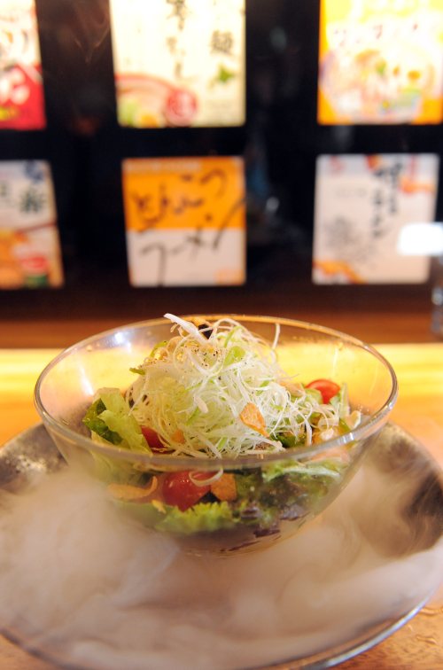 Ippudo Seoul serves up their citrusy ramen salad over a bed of dry ice, making the experience of slurping cold, house-made noodles all the more refreshing. (Ahn Hoon/The Korea Herald)