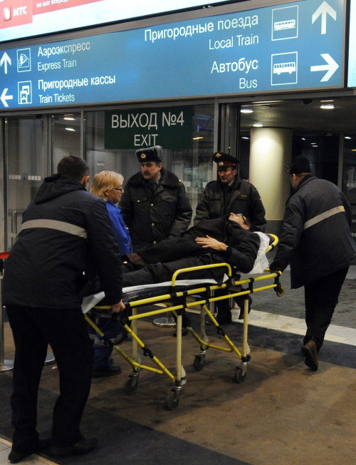 A bombing victim is wheeled by paramedics from Domodedovo International Airport. (MCT)