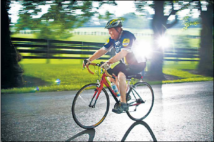 Bill Cole, of the Bluegrass Cycling Club, rolls down Pisgah Pike ona Sunday bike ride in Lexington, Kentucky. (Lexington Herald-Leader/MCT)