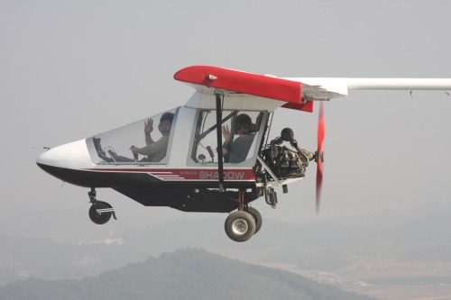 An instructor and a rider enjoy a ride on a light airplane. (Hwaseong City)