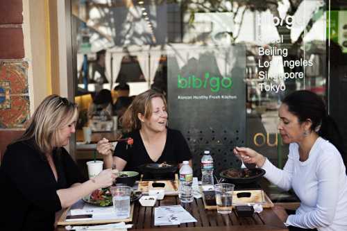 Customers eat bibimbap at the patio of Bibigo’s Los Angeles branch. (CJ Foodville)