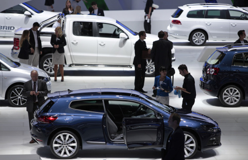 Visitors look at Volkswagen AG automobiles displayed on the company’s stand during the Frankfurt Motor Show, in Frankfurt, Germany, on Tuesday. (Bloomberg)