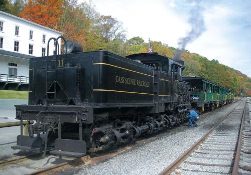 A staffer on the Cass Scenic Railroad checks the historic Shay steam locomotive. The historic hamlet of Cass, West Virginia, is a state park and attracts 75,000 visitors a year. (Akron Beacon Journal/MCT)