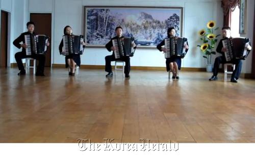 A YouTube capture shows five North Korean students playing 1980s hit “Take on Me” with their accordions. (YouTube capture)