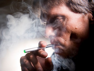 A man smokes an electric cigarette. (MCT)