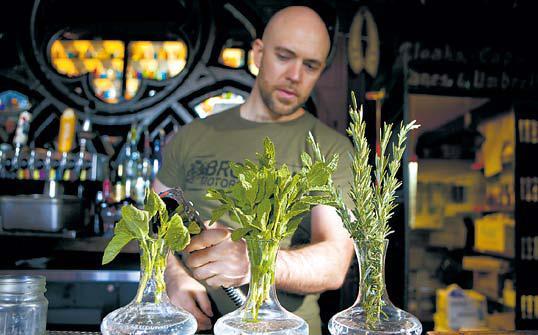 Dave Whitton creates some of the drinks at his Villain’s Tavern in the Arts District of downtown Los Angeles. (LA Times/MCT)