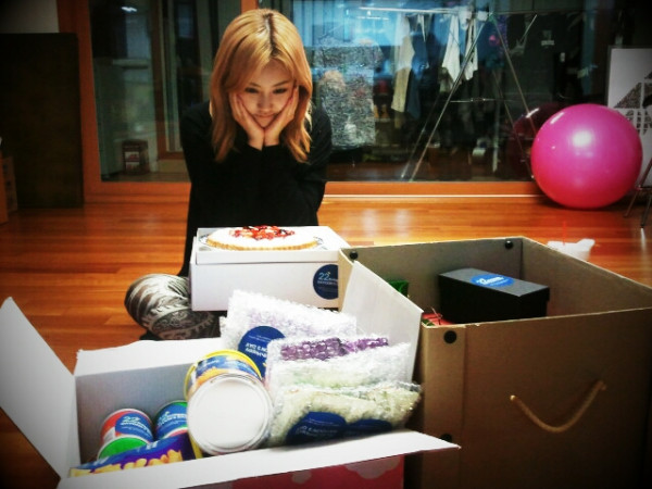 Heo Ga-yoon of girl group 4minute poses behind birthday gifts (Ga-yoon`s Twitter accout)
