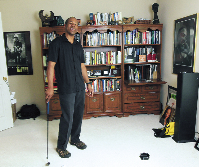 Poet Frank X. Walker keeps a putter in his home office in Lexington, Kentucky, on April 17, because sometimes his creative process involves hitting a golf ball around. Walker was recently named Kentucky’s poet laureate. (Lexington Herald-Leader/MCT)