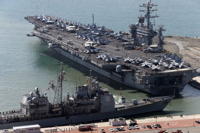 The aircraft carrier USS Nimitz is anchored off a naval port in Busan on Saturday. (Yonhap News)