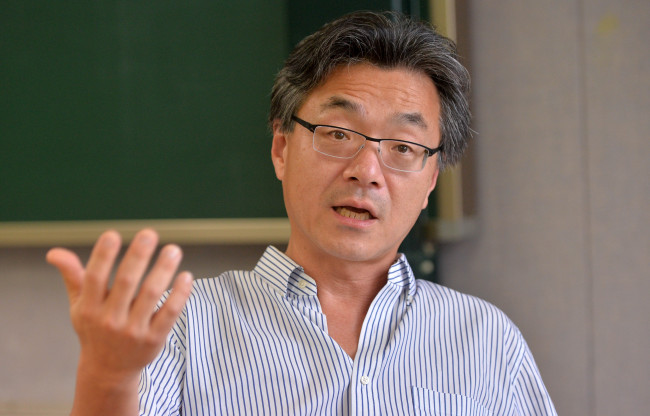John Lie speaks during an interview with The Korea Herald at Kyung Hee University. (Lee Sang-sub/The Korea Herald)