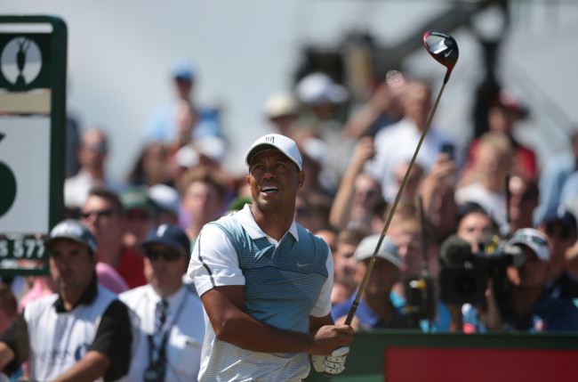 Tiger Woods tees off on the 16th hole on Thursday. (UPI-Yonhap)