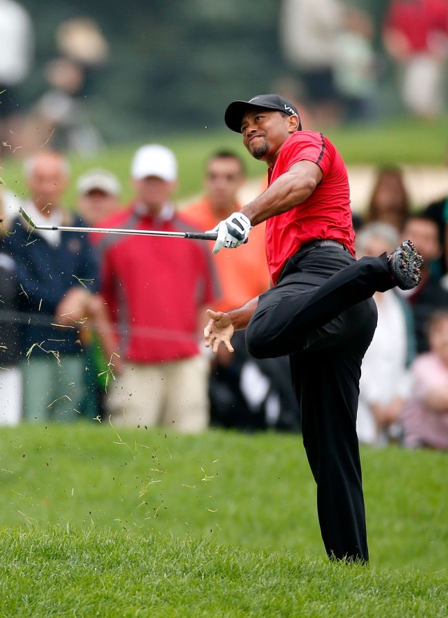Tiger Woods hits out of the rough on the second hole during the final round of the World Golf Championships-Bridgestone Invitational on Sunday. (AFP-Yonhap)