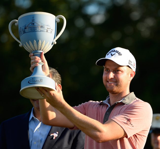 Chris Kirk poses with the winner’s trophy on Monday. (EPA-Yonhap)