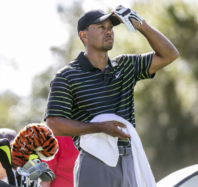 Tiger Woods checks out the course from the third tee on Thursday. (AP-Yonhap)