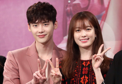 Actors Lee Jong-suk (left) and Han Hyo-joo pose for a photo at the press conference for upcoming mini-series “W” at MBC headquarters in Seoul on July 18. (Yonhap)