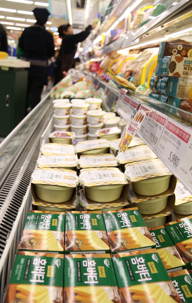 caption: Dairy products are displayed at an E-mart store in Seoul. E-mart