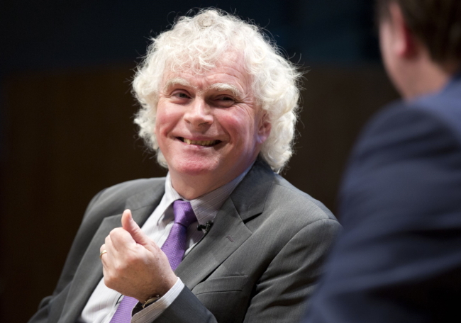The London Symphony Orchestra's Music Director Designate Simon Rattle speaks during a press conference in London on Tuesday. (AFP-Yonhap)