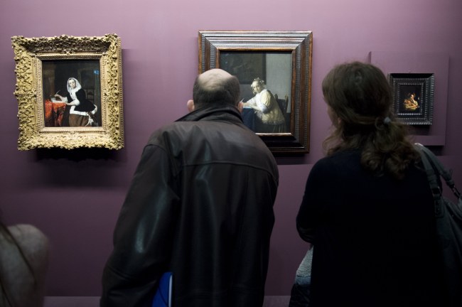 The artwork entitled “La Lettre Interrompue” (center) by Dutch artist Johannes Vermeer is displayed during the exhibition “Vermeer and the Masters of the Paintings” at the Louvre in Paris on Tuesday. (EPA-Yonhap)