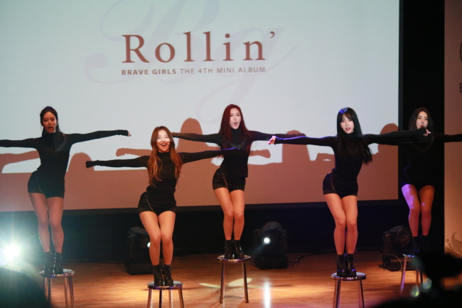 Members of the K-pop group Brave Girls speak during their showcase for the new EP “Rollin’” in Gangnam-gu, Seoul on Tuesday. (Brave Entertainment)