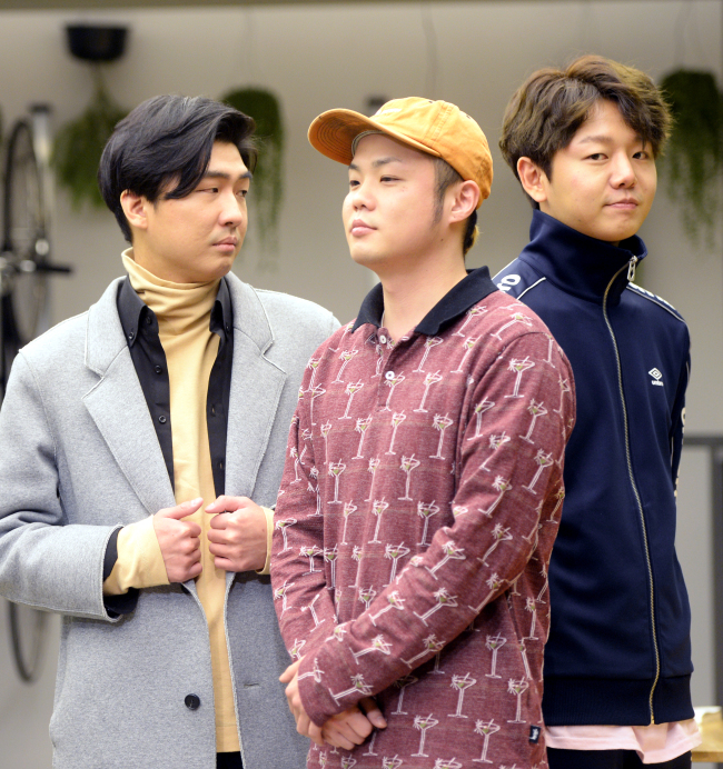 Band Life and Time pose before an interview at a cafe in Apgujeong-dong, southern Seoul, on Feb. 22. From left are Im Sang-wook, Park Sun-bin and Jinsil. (Park Hyun-koo/The Korea Herald)