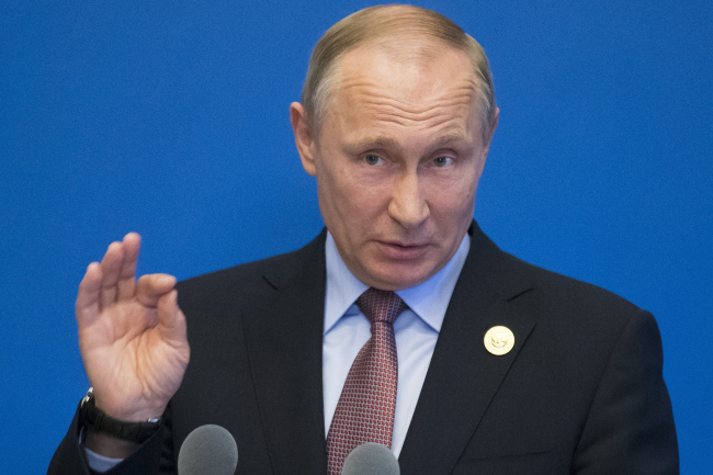 Russian President Vladimir Putin gestures while speaking to the media after the Belt and Road Forum at the China National Convention Center at the Yanqi Lake venue outskirt of Beijing in China, Monday. (AP)