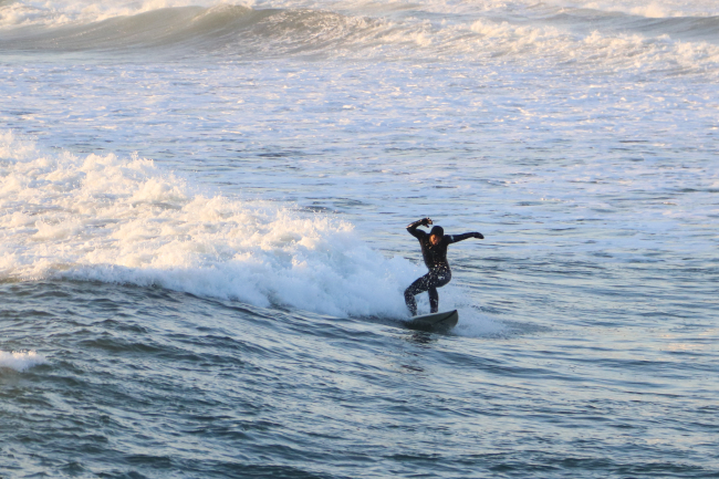 A surfer catches a wave off Jukdo Beach in Yangyang, Gangwon Province.