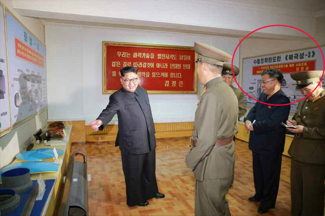 North Korean leader Kim Jong-un visits the Chemical Material Institute of the Academy of Defense Science in this undated photo released by North Korea’s Korean Central News Agency on Wednesday. A display titled “Pukguksong-3” (circled) is shown in the background. Yonhap