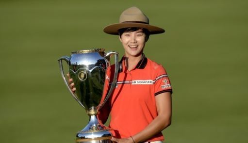 In this Associated Press photo, Park Sung-hyun of South Korea poses with the champion`s trophy after winning the Canadian Pacific Women`s Open on the LPGA Tour in Ottawa on Aug. 27, 2017. (Yonhap)