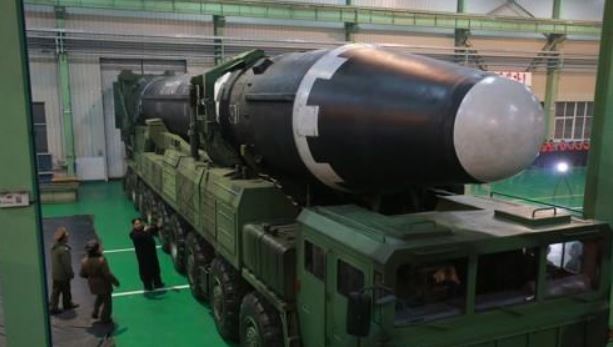 North Korea`s new Hwasong-15 ICBM lies mounted on a mobile launcher in this photo released by its state media. (For Use Only in the Republic of Korea. No Redistribution) (Yonhap)