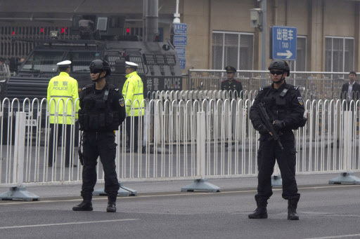 Heavily armed police guard an area outside a train station ahead of the arrival of a convoy in Beijing, China, Tuesday, March 27, 2018. The activity followed the arrival Monday of a train resembling one used by North Korea`s previous leader, and a foreign guesthouse in Beijing had a heavy security presence overnight. Some media have speculated that North Korean leader Kim Jong Un was making a surprise visit to China. (AP - Yonhap)