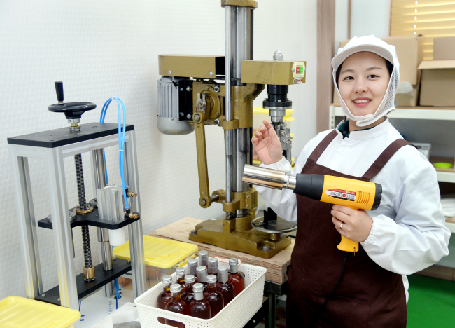 Song Ju-hee, an owner of the oil company Neorean, poses at her factory. (Park Hyun-koo/The Korea Herald)